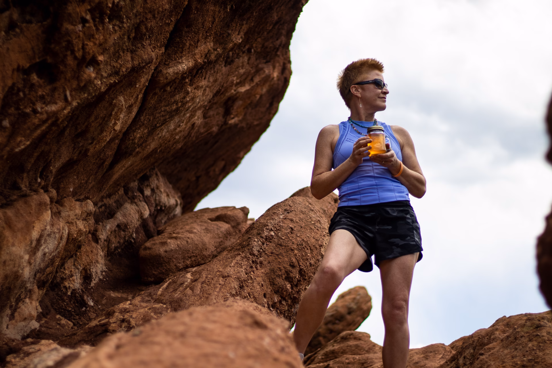 janie otero on a mountain with springs culture kombucha