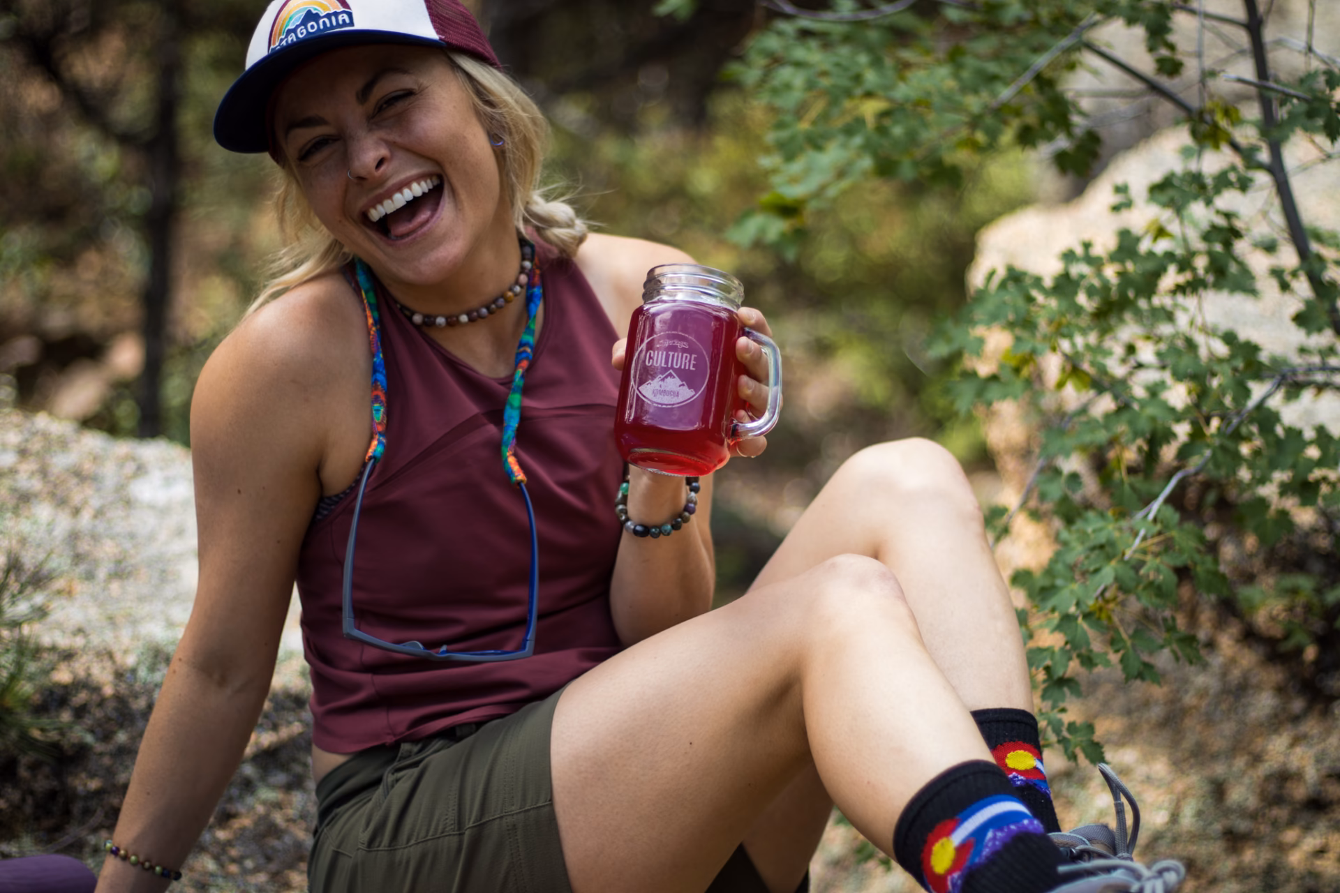 sitting, smiling, sipping, booch, kombucha in the wild