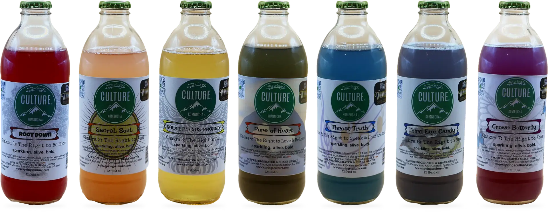 The seven Springs Culture Chakra Collection kombuchas lined up from Root Down to Crown Butterfly
